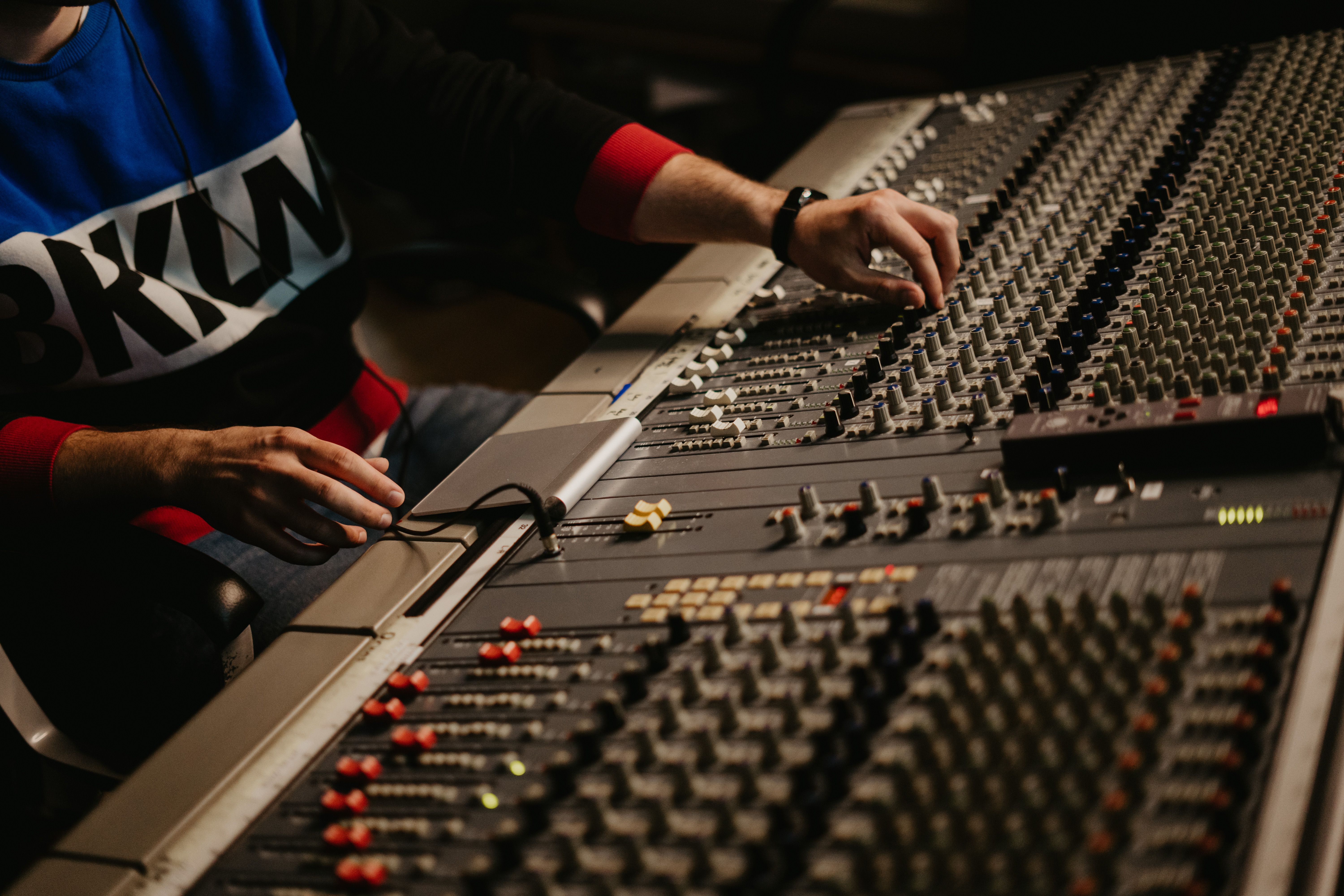 Stock photo — a sound engineer at the control panel of a recording studio (placeholder; swap for real Intentional Studios photography)