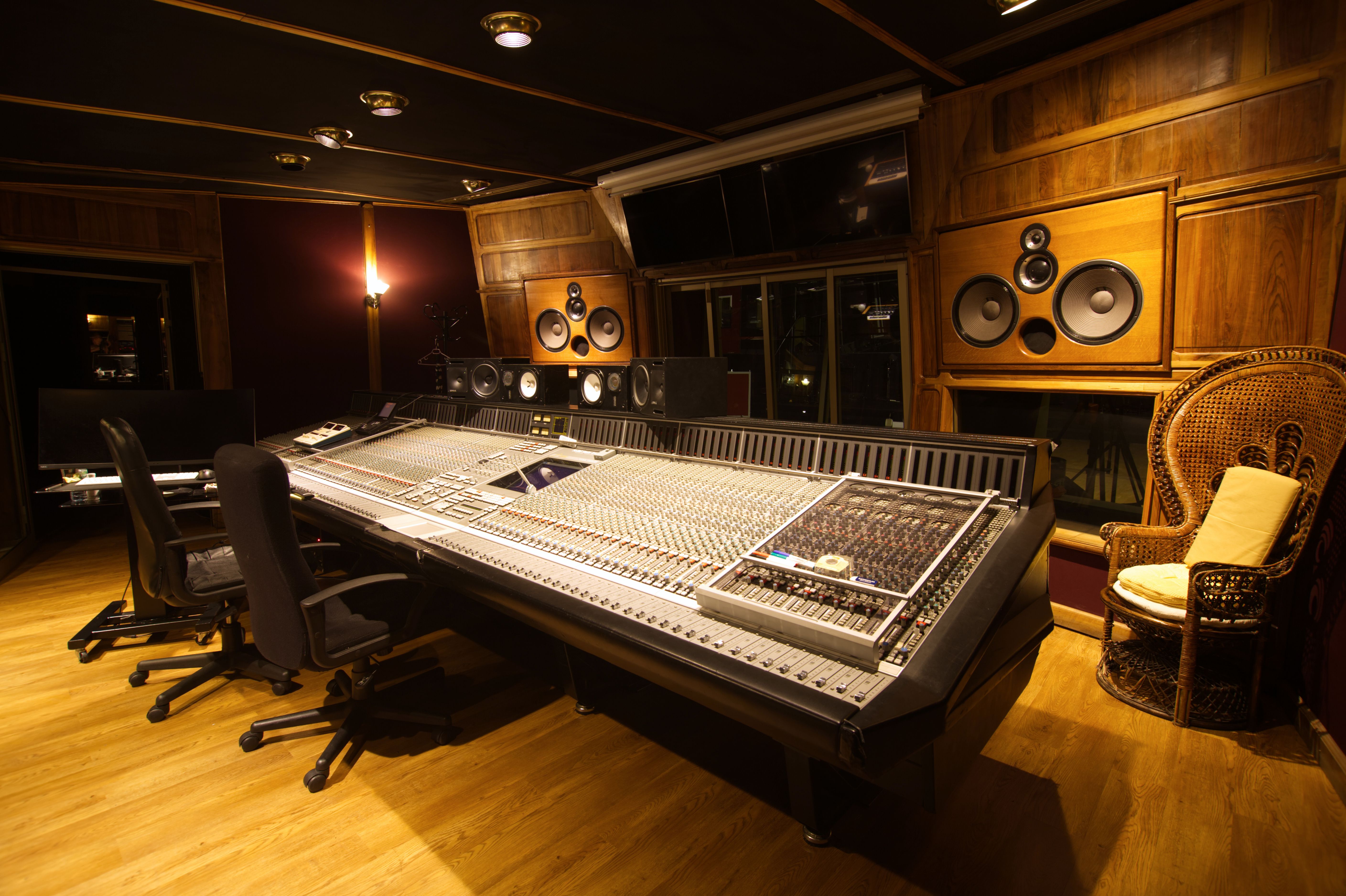 Stock photo — audio equipment and a mixing console inside a recording studio (placeholder; swap for real Intentional Studios photography)