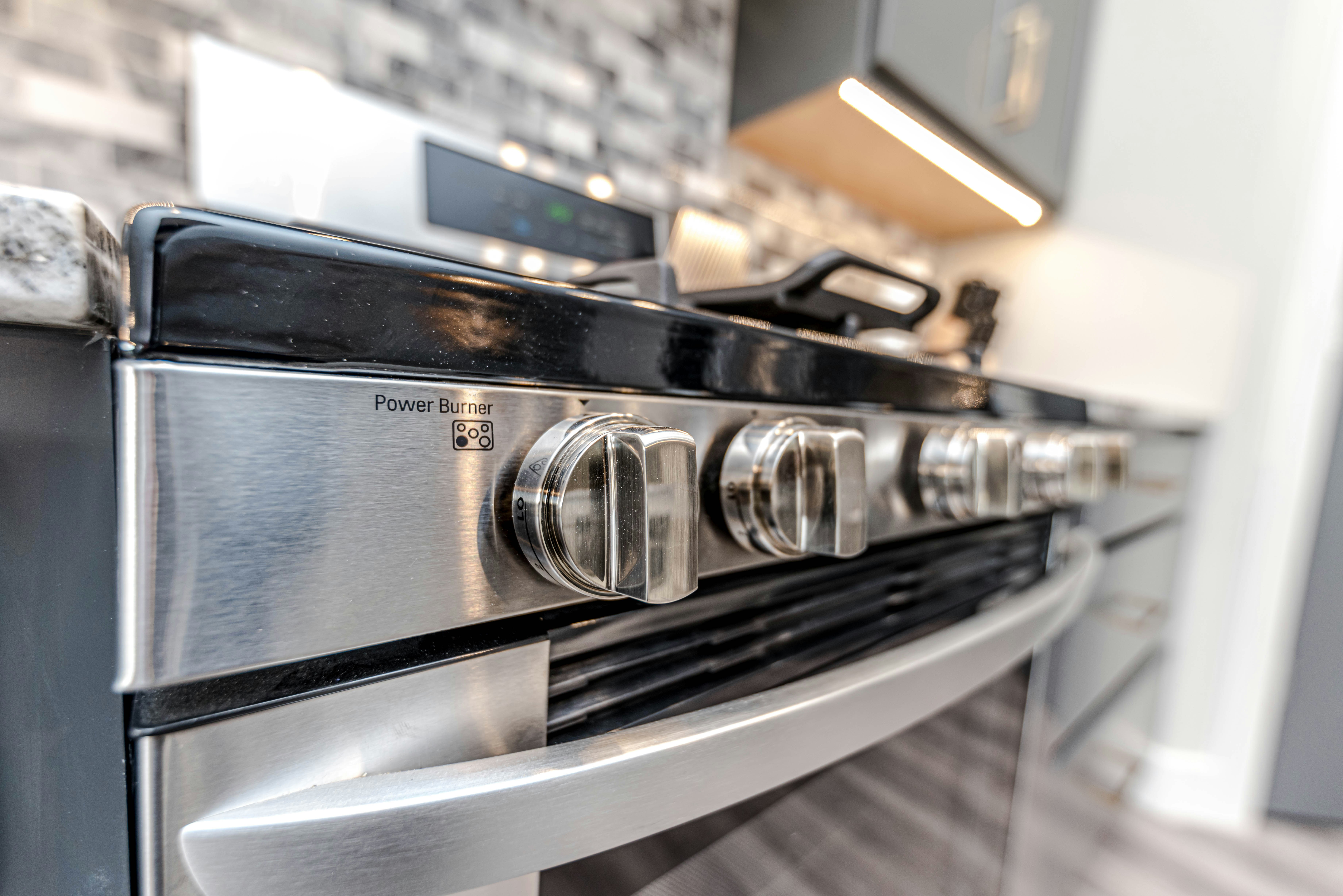 Close-up of a stove and oven in a modern kitchen